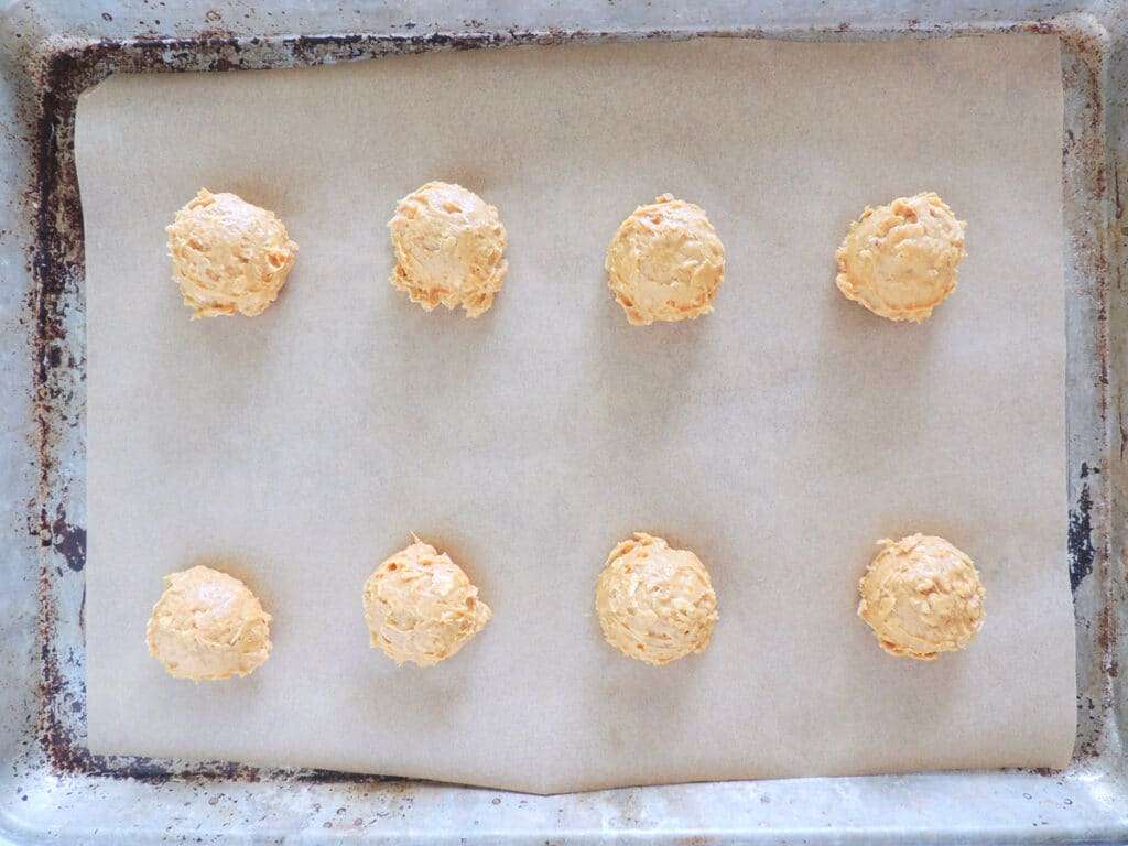Place cookie dough balls on prepared cookie sheet