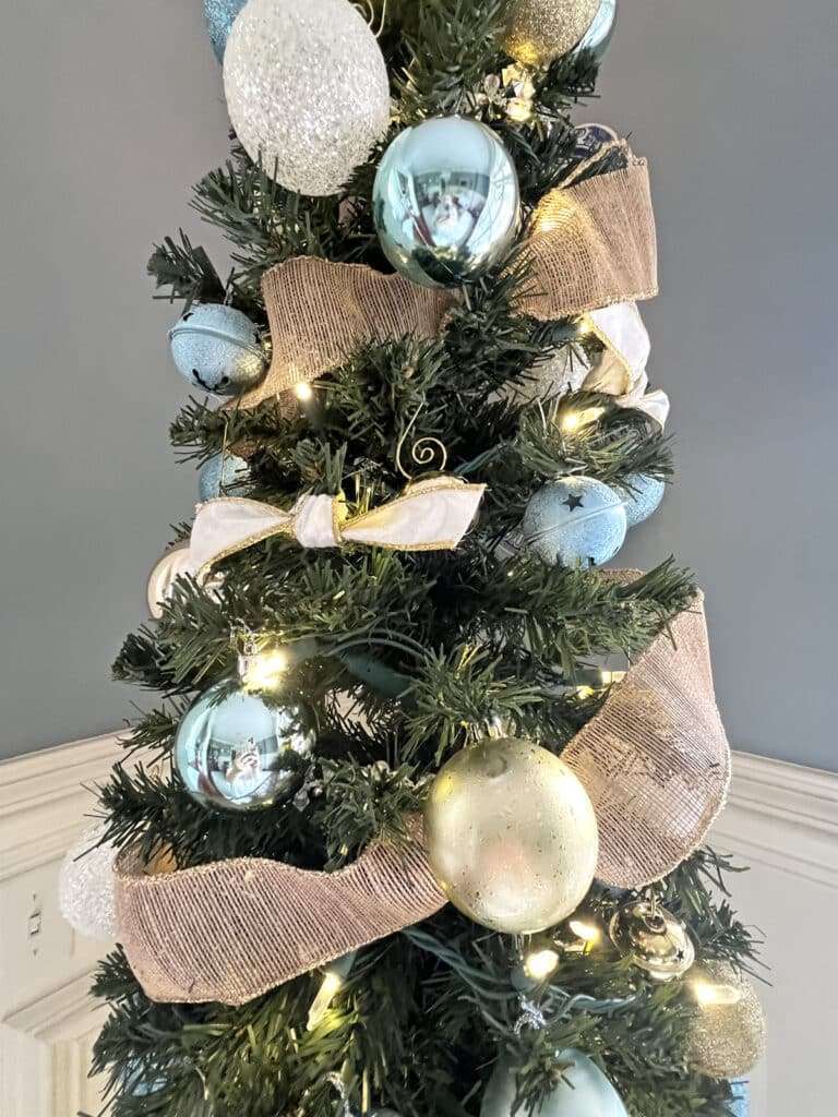blue white and gold Christmas decorations on the tree
