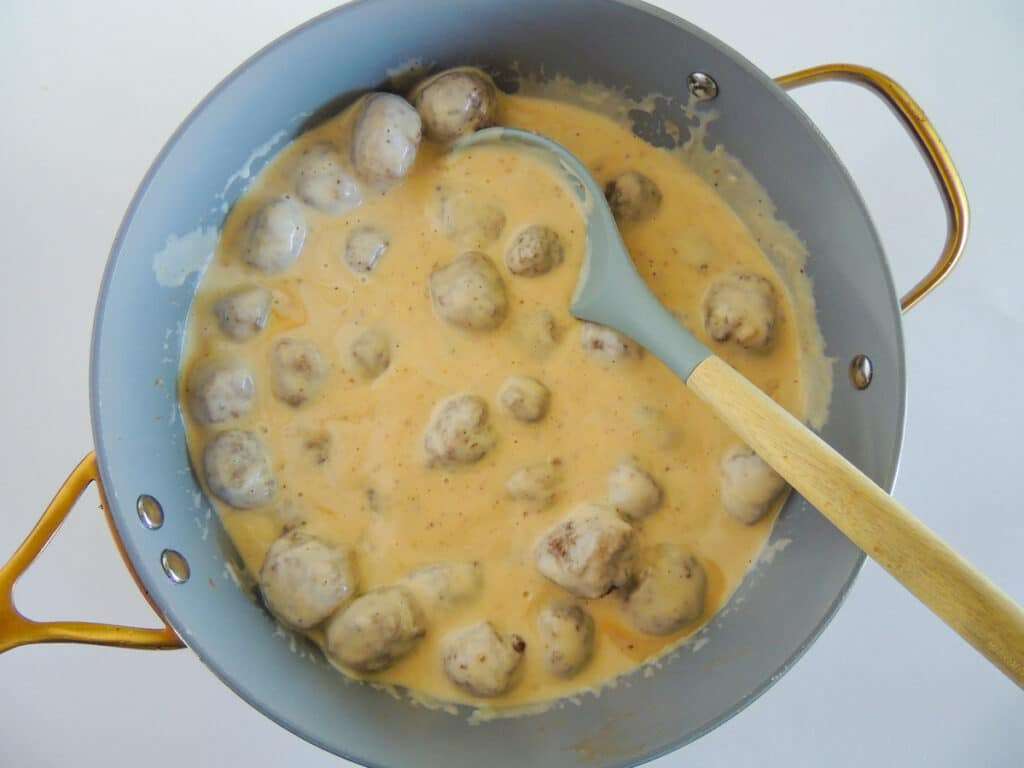 Add the meatballs into the gravy