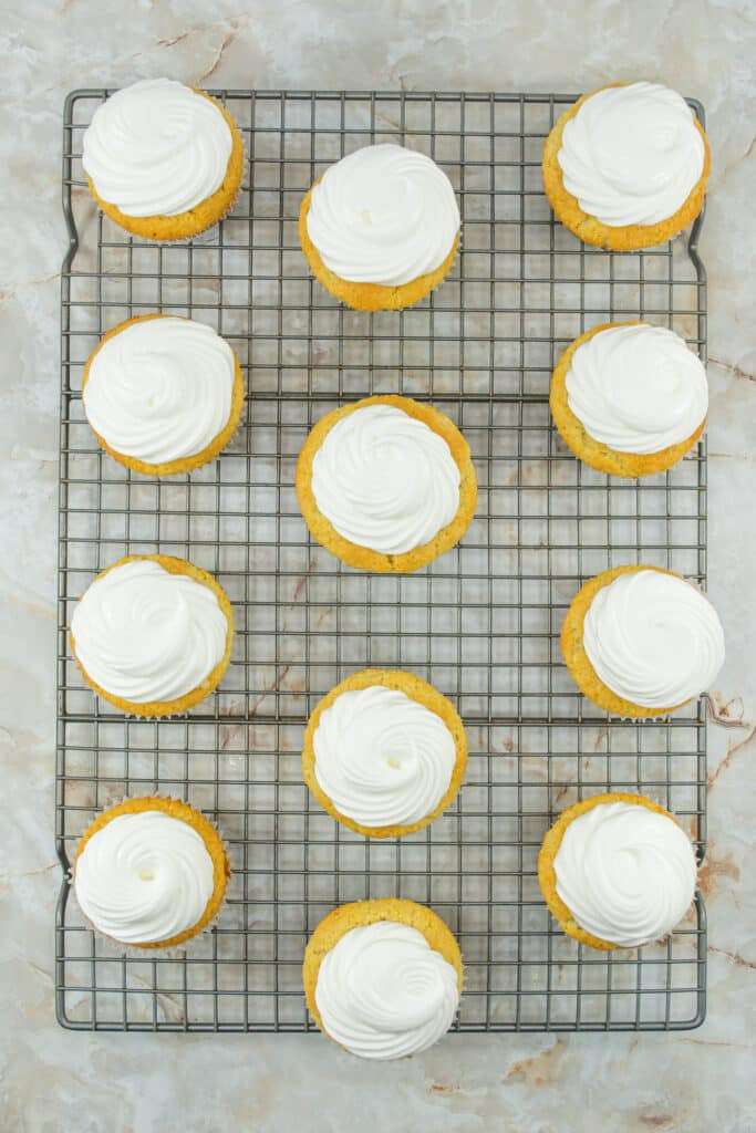 Use a piping bag to top each cupcake with meringue