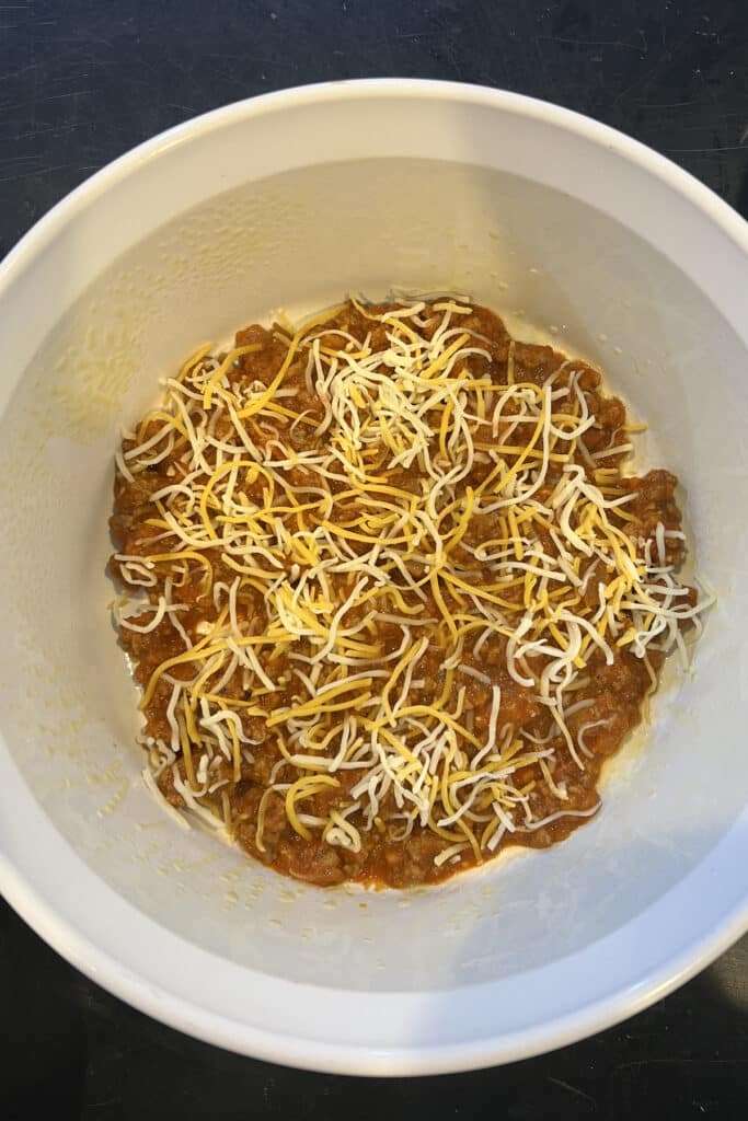 Next layer shredded cheddar
