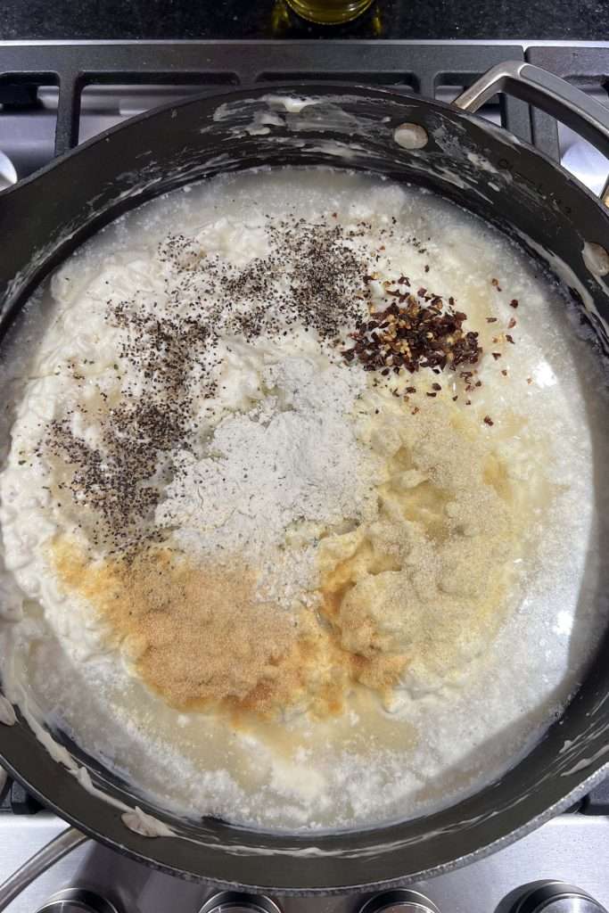 Add chicken broth and seasonings