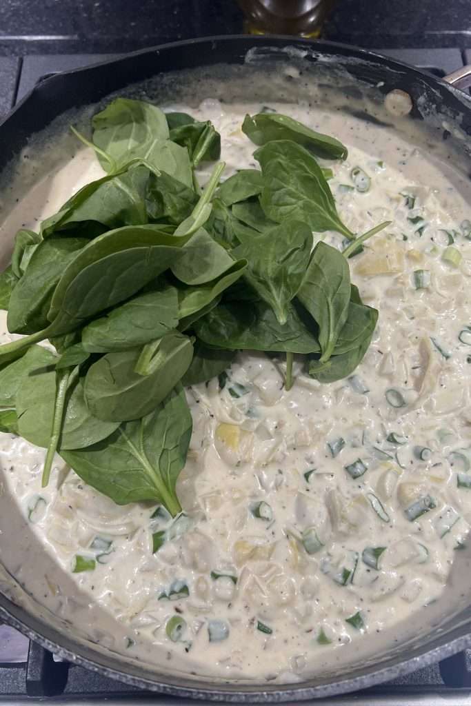 Add spinach a handful at at time