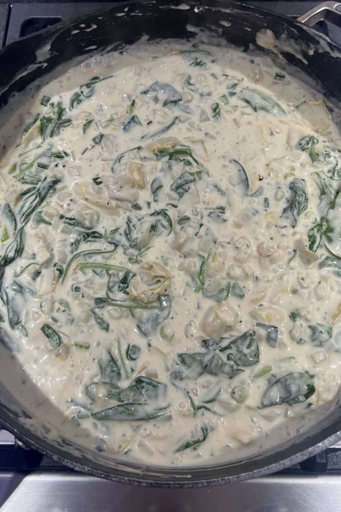 Keep adding spinach and stirring until it's incorporated