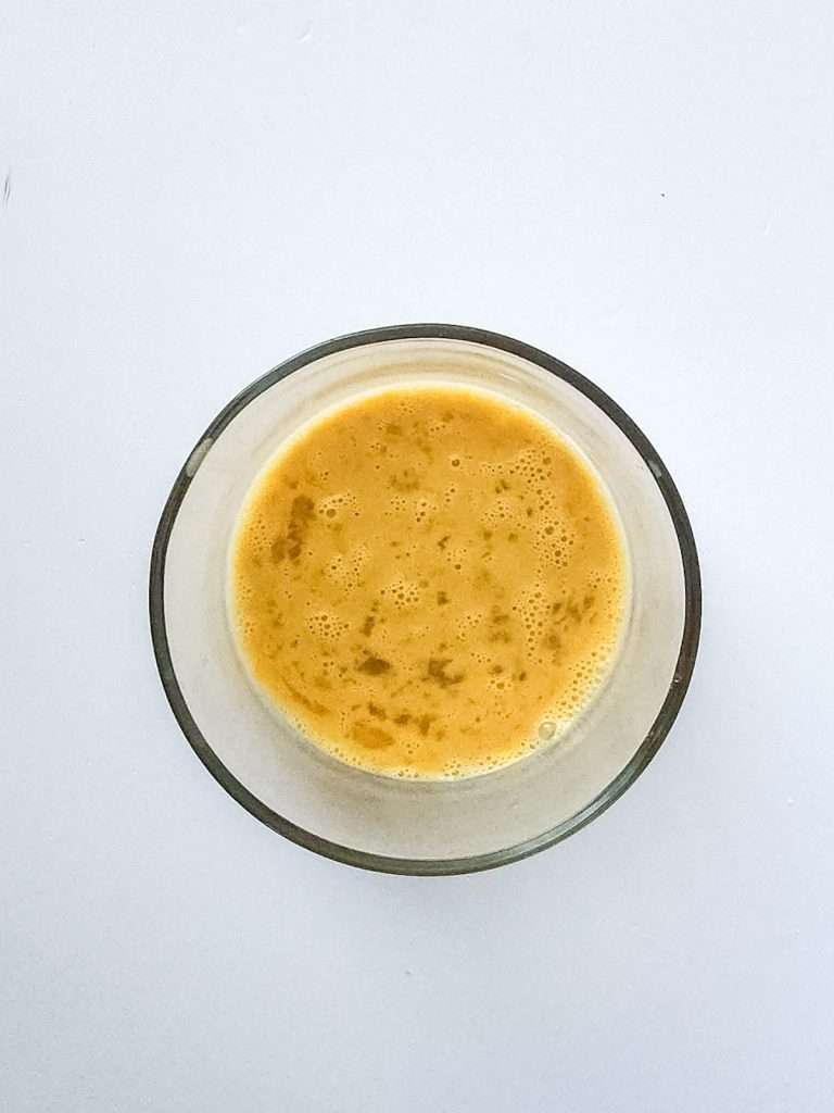 add some of the warm milk mixture into the eggs