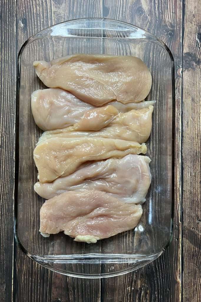 Arrange the chicken breasts in a single layer in a baking dish