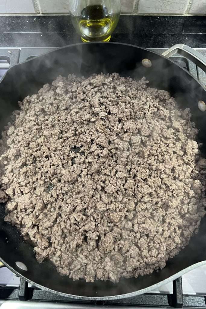 Drain excess fat from cooked ground beef