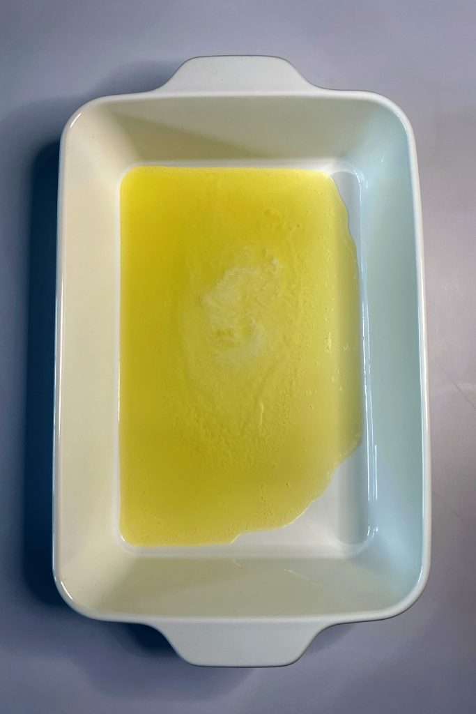 Melt butter in the bottom of the baking dish