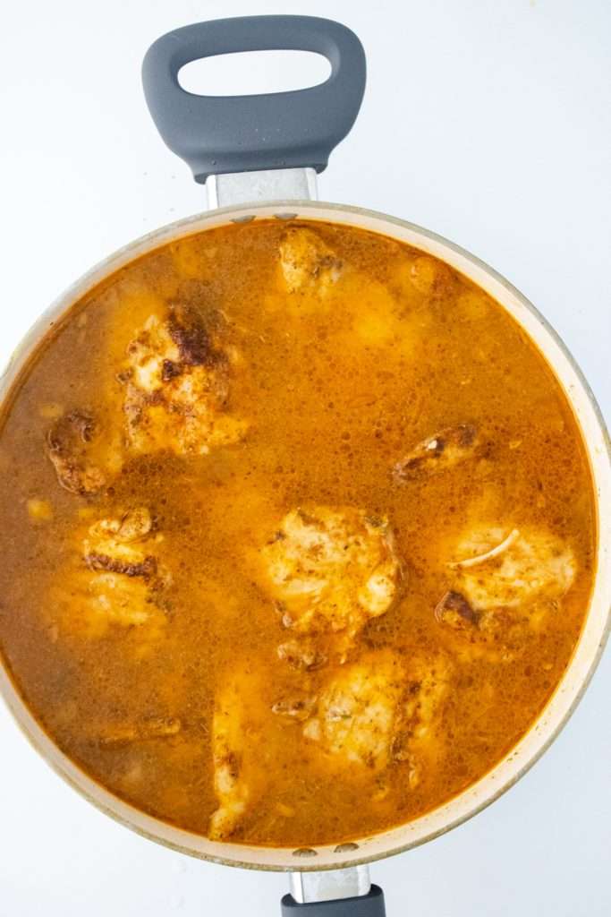 Add the chicken back into the Dutch oven