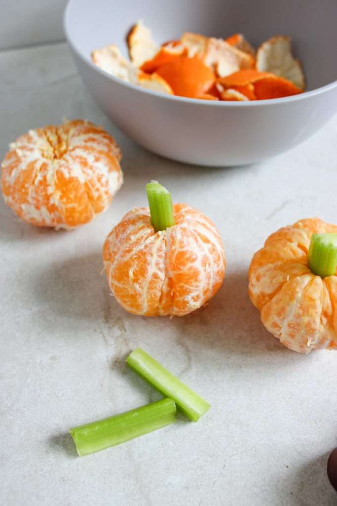 Peel oranges and add celery stems