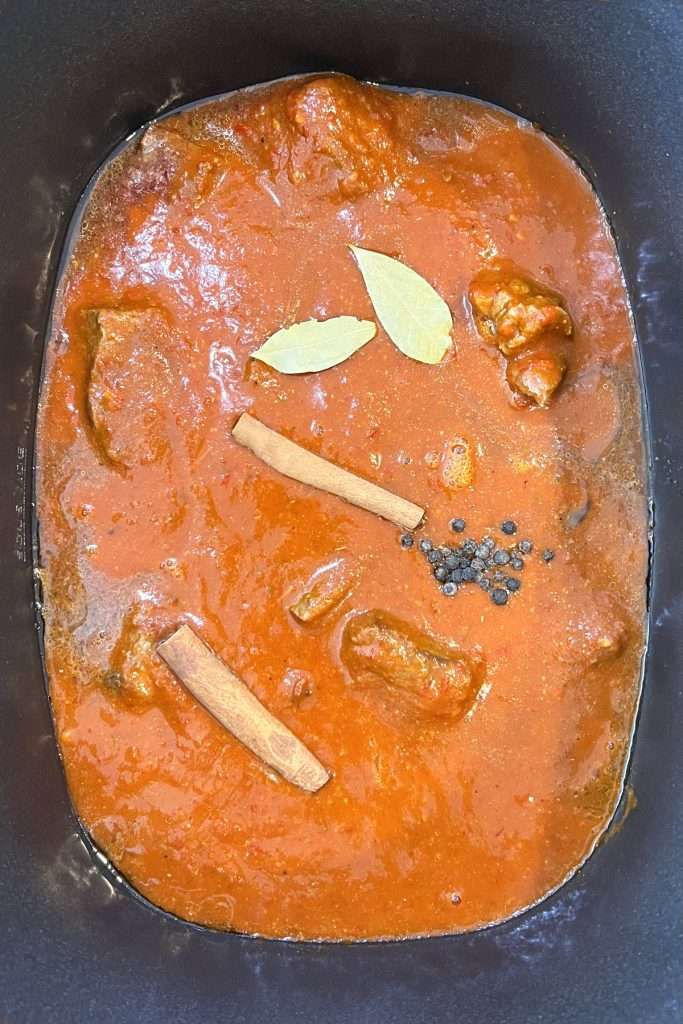 Add bay leaves, cinnamon sticks, and peppercorns