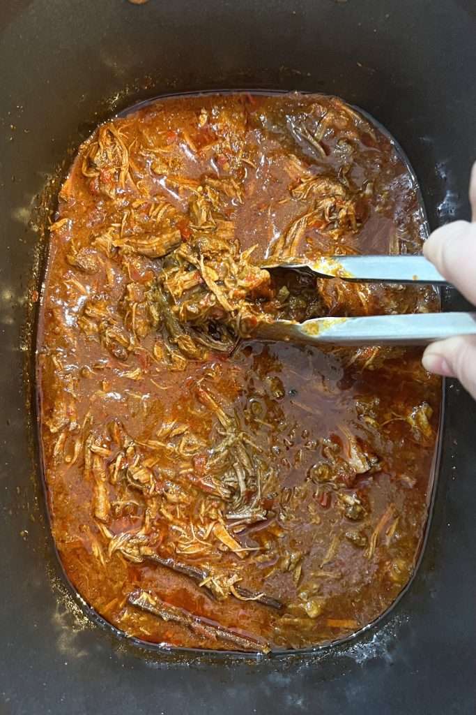 Return shredded beef to crockpot and stir