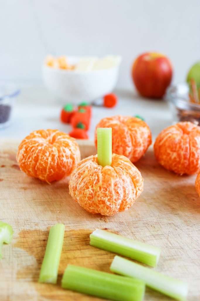Mini pumpkins - Mandarin oranges with celery stick stems