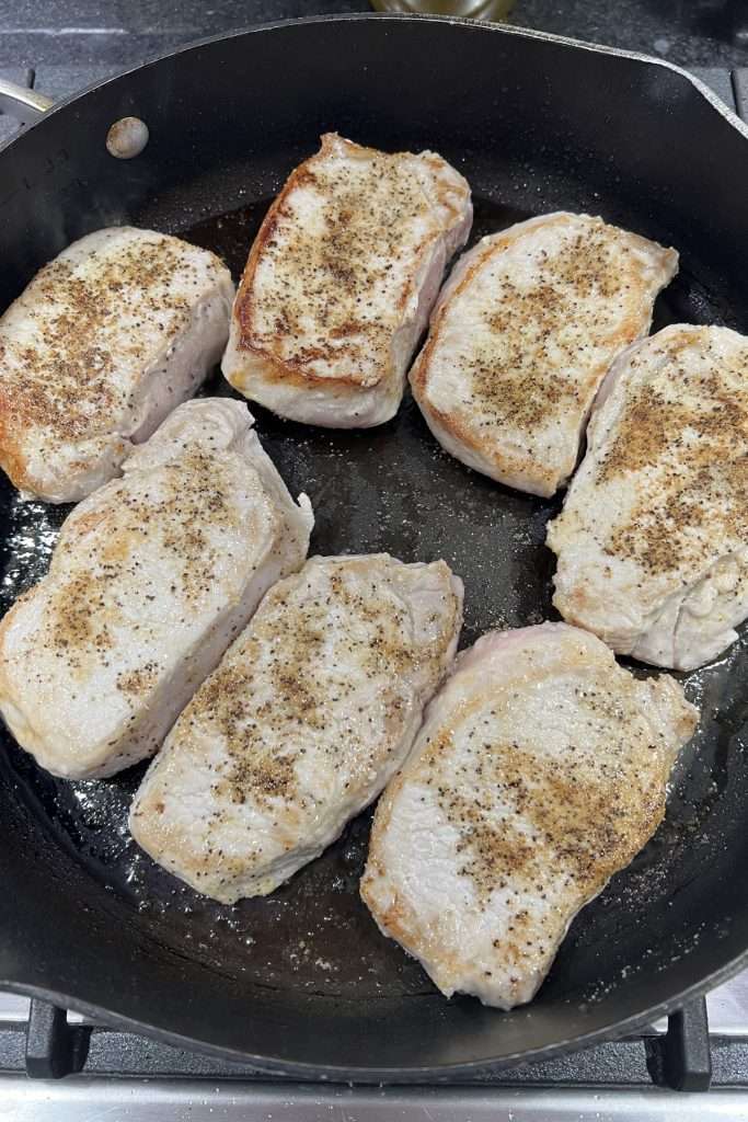 Sear pork chops on both sides