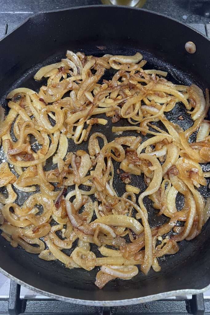 Cook onions over medium heat stirring occasionally until golden brown