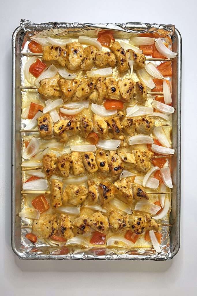 Bake. Add onions and bell peppers to pan if desired