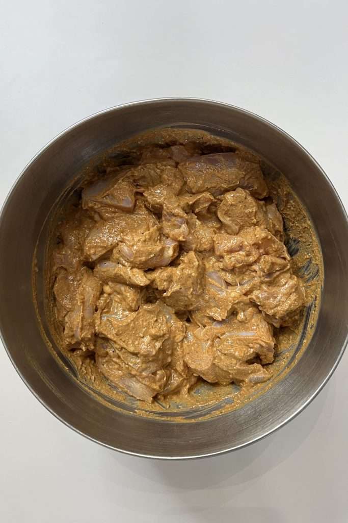 Cut chicken into 1-2-inch pieces, then place into the bowl. Mix to coat each piece of chicken.