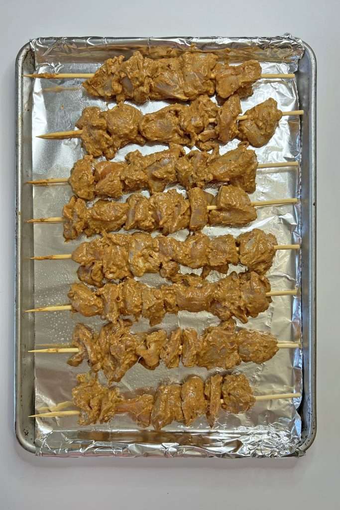 Skewer chicken and place on prepared baking sheet