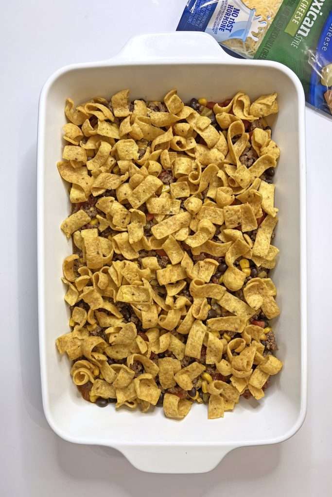 Add Fritos to the top of the meat