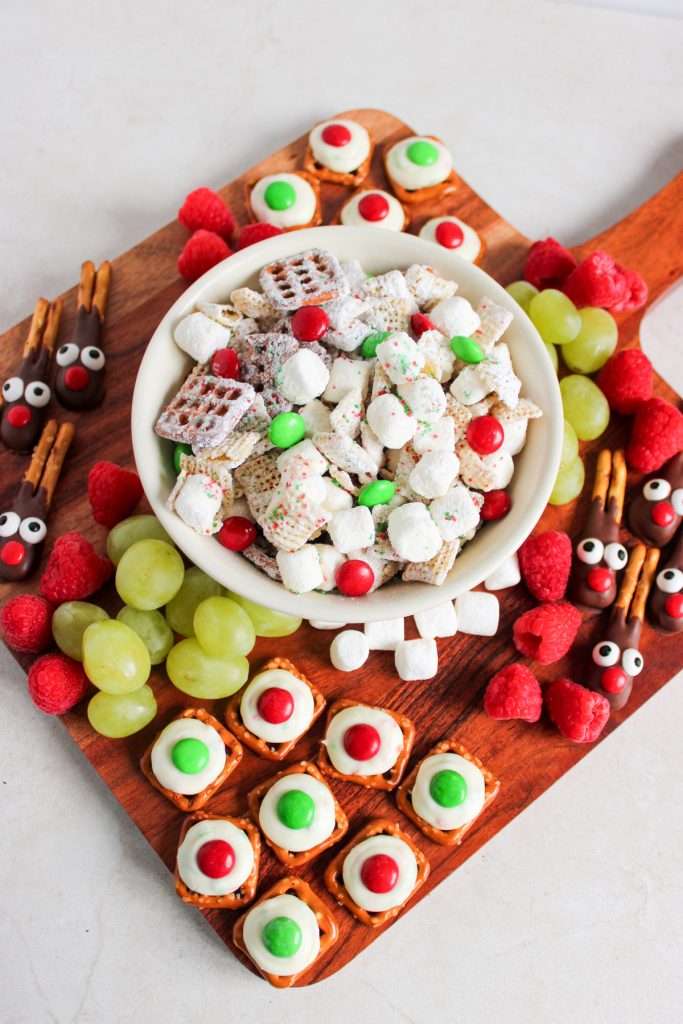 Add pretzel bites and reindeer pretzels on opposite corners of the charcuterie board