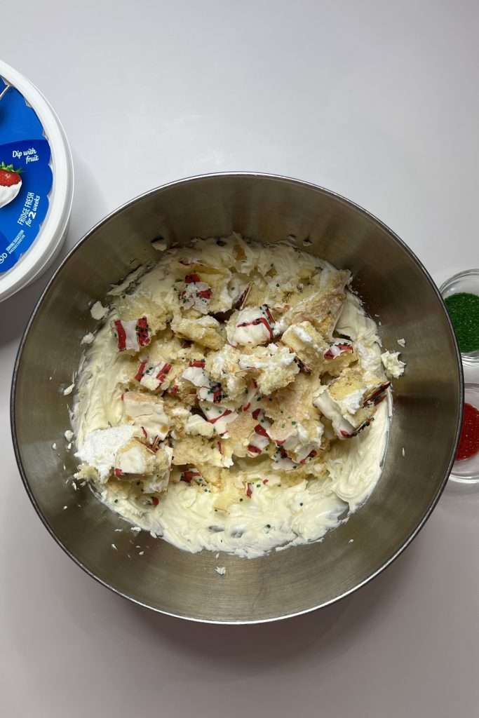 Break the Christmas Tree Cakes and add to bowl