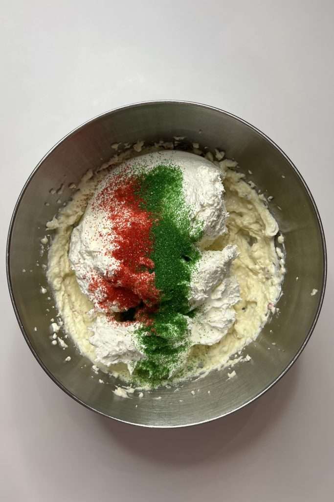Add sprinkles, milk, Cool Whip, and vanilla extract