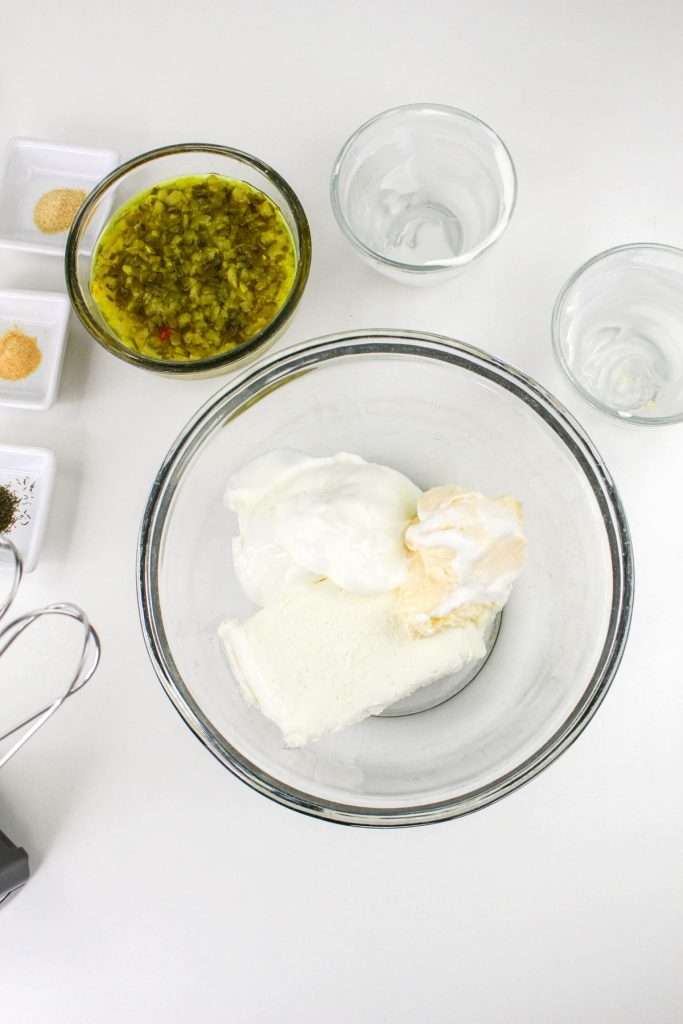 Mix mayo, cream cheese, and sour cream