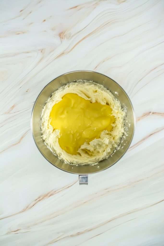 Add the homemade or store-bought lemon curd to the bowl.