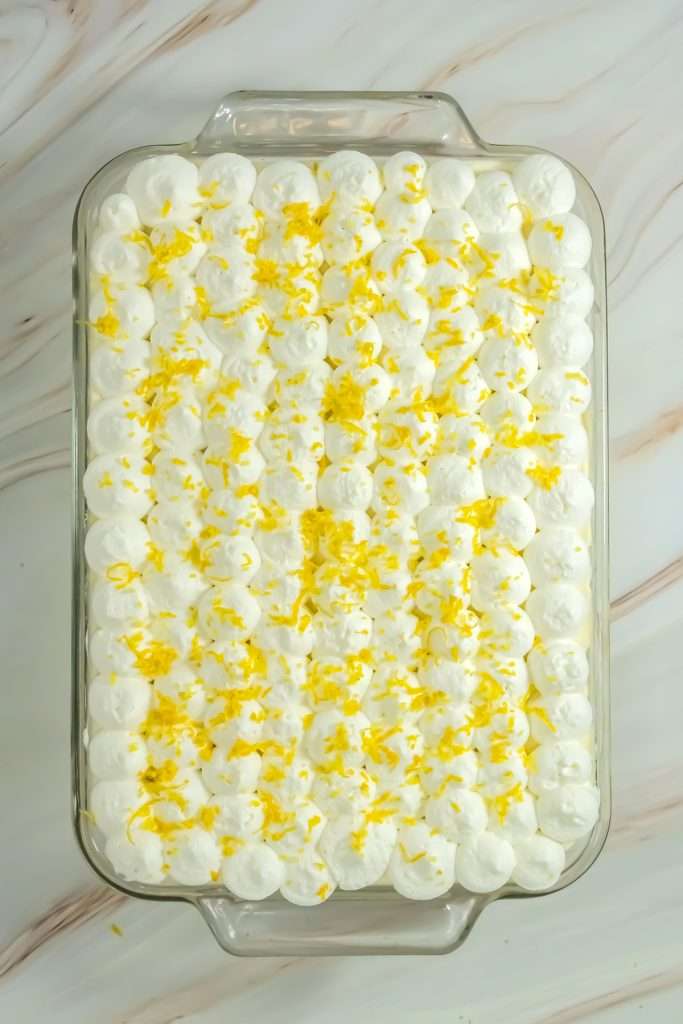 Finally, garnish with freshly grated lemon zest.