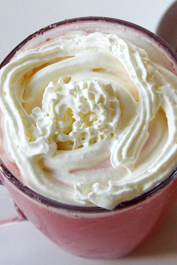 Pour into mugs and top with whipped cream