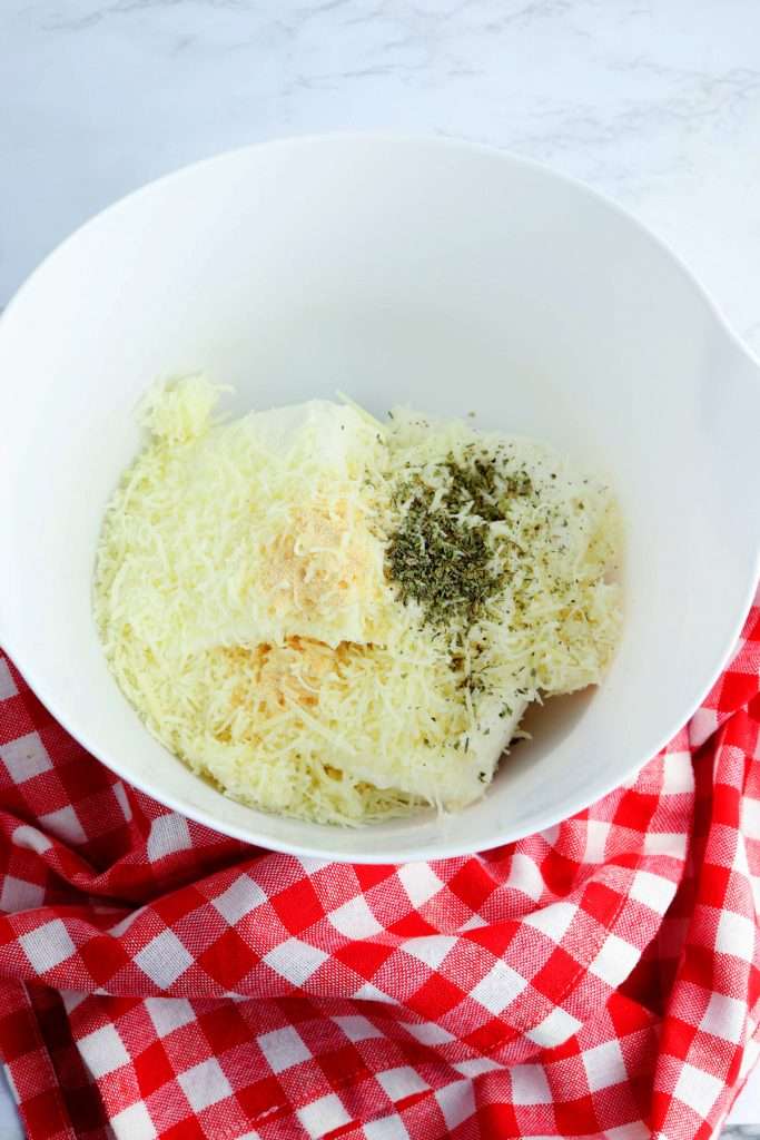 Combine cream cheese, mozzarella cheese, Italian seasoning, and garlic powder.