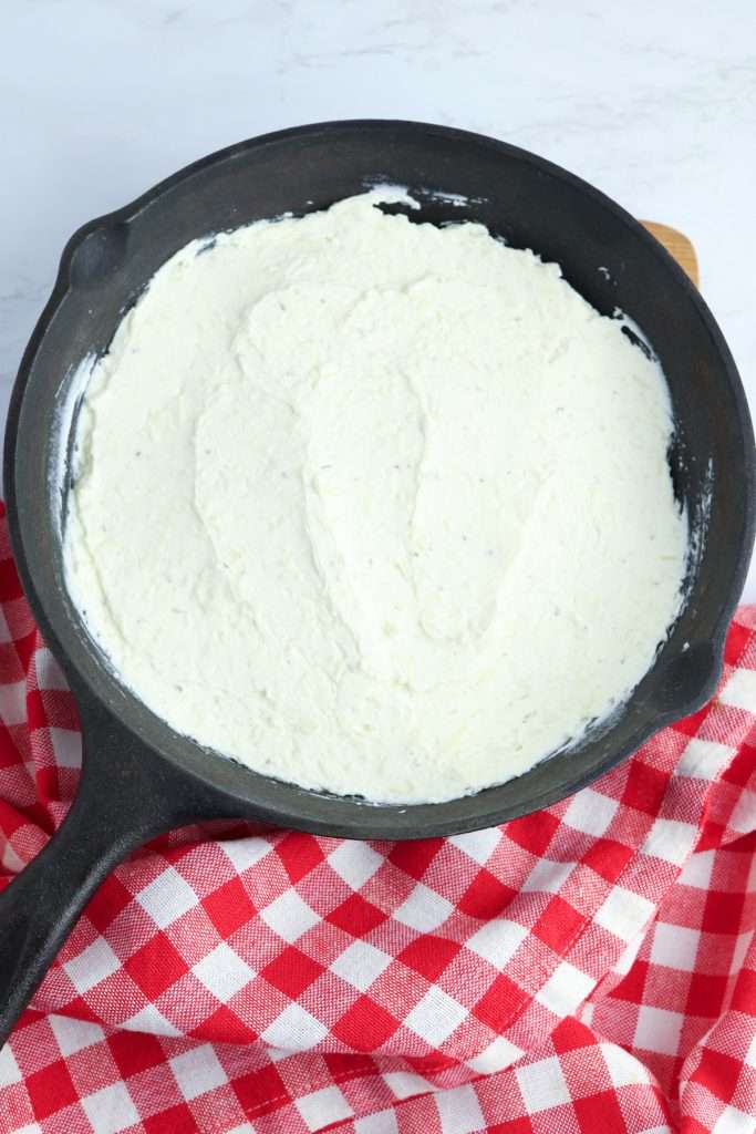 Spread the cheese mixture into an oven-proof dish.