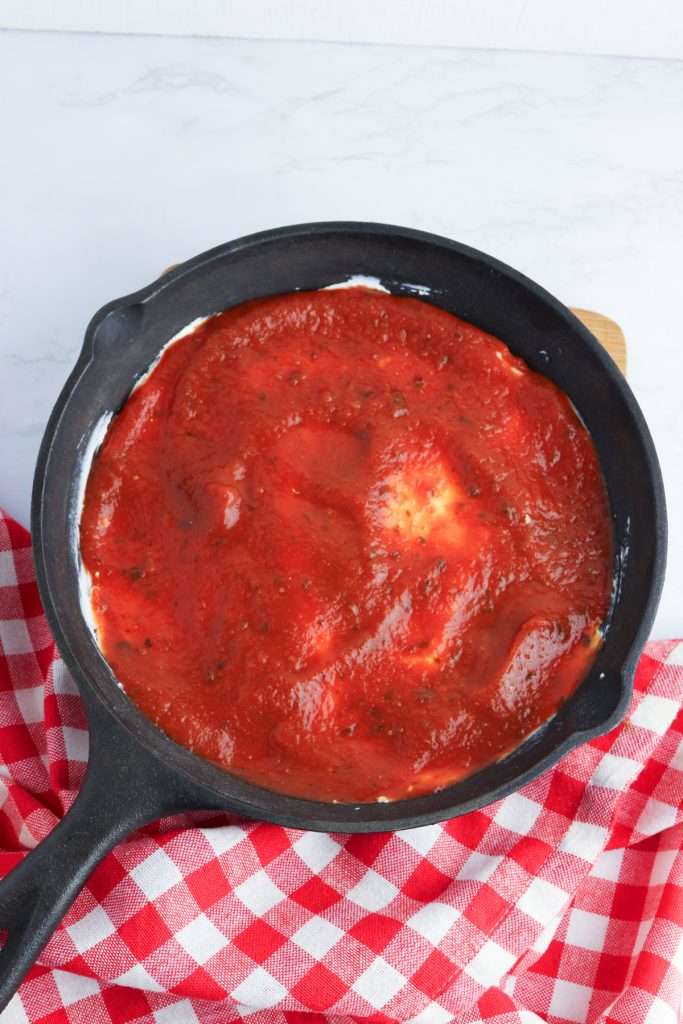 Top with a layer of marinara sauce.