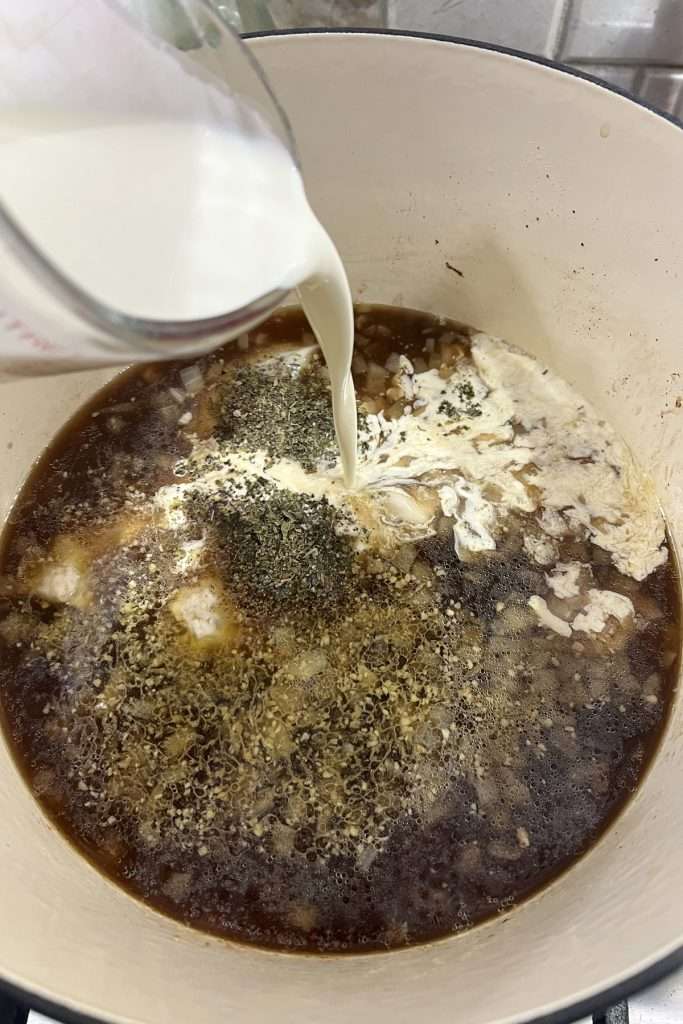 Add seasonings and heavy cream