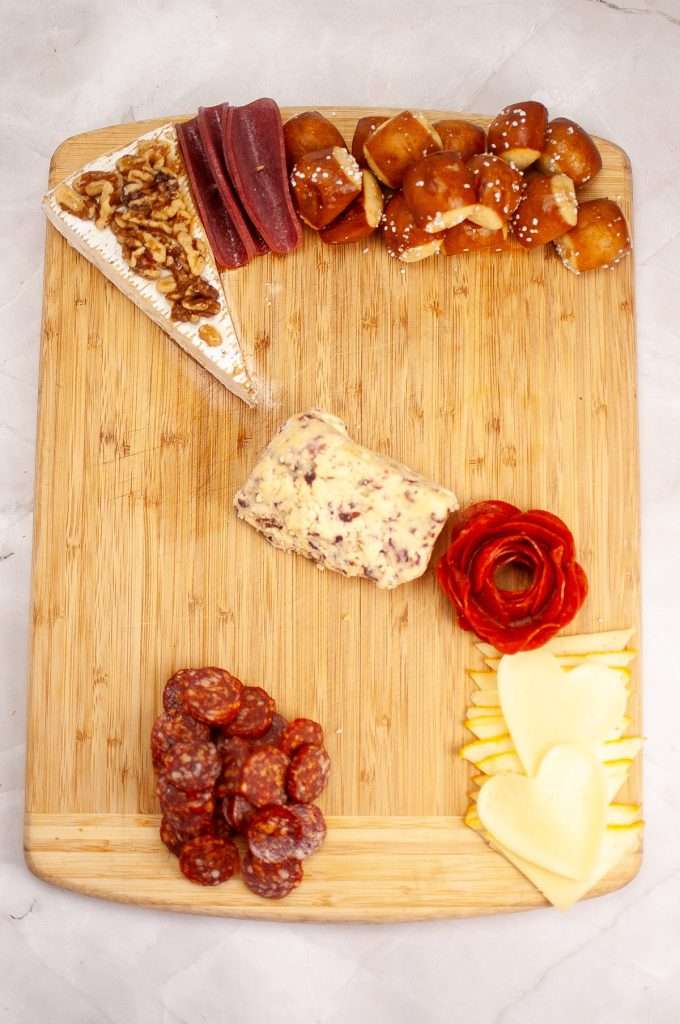 Arrange meats on your charcuterie board