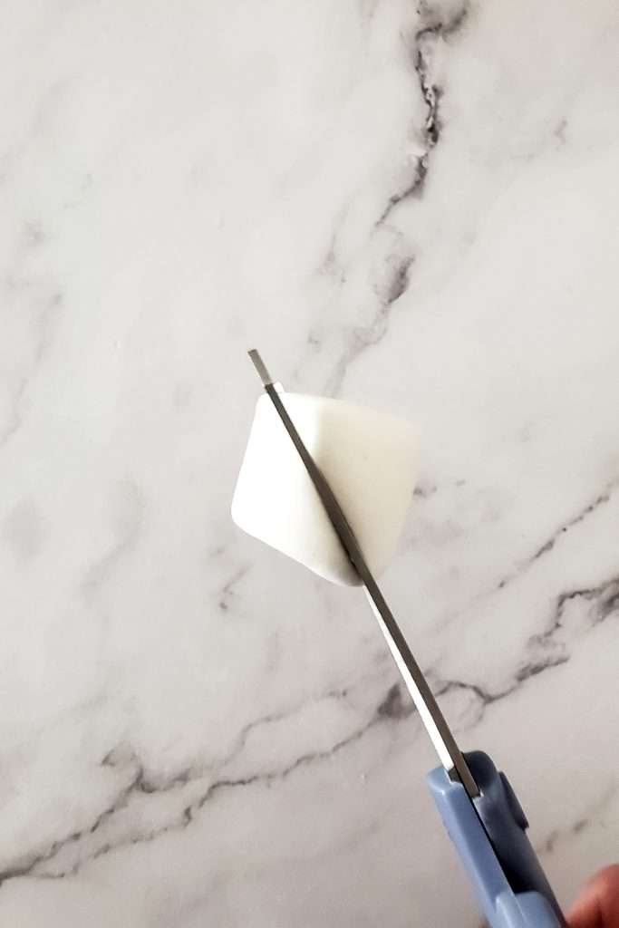 Cut a large marshmallow in half diagonally