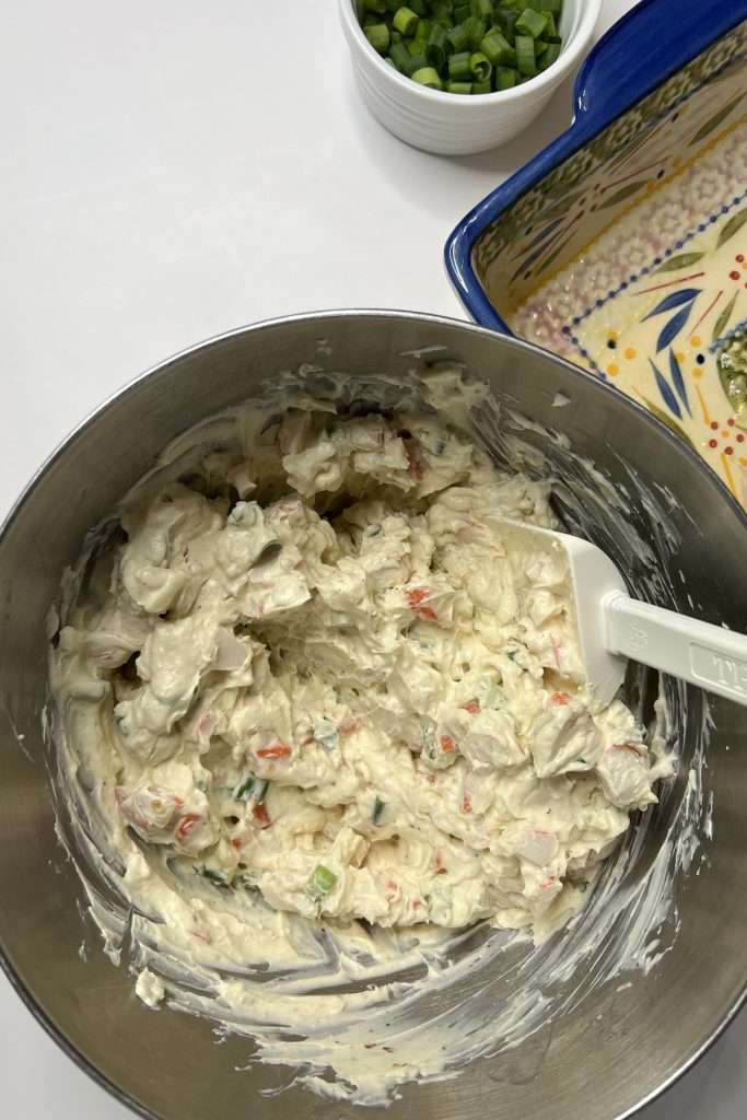 Fold crab meat into the mixture.