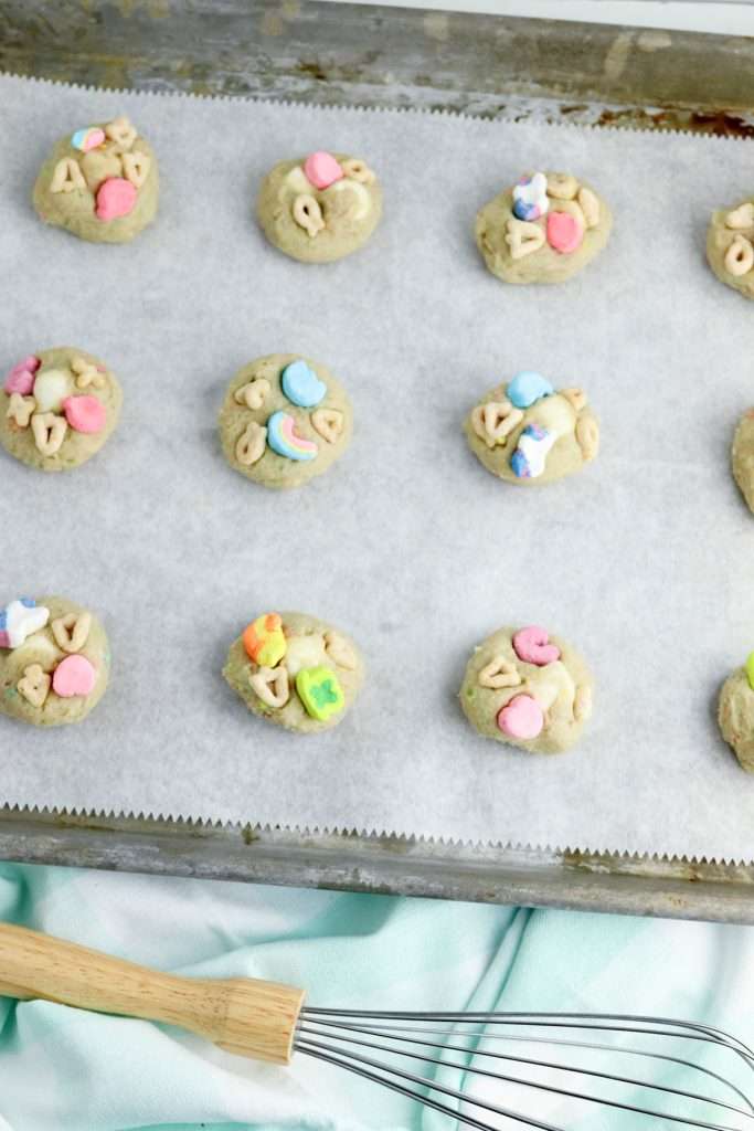 Scoop onto prepared cookie sheet and top with additional cereal pieces.