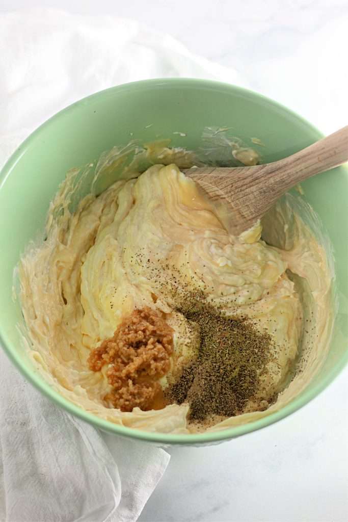 Combine soup, sour cream, and seasonings.