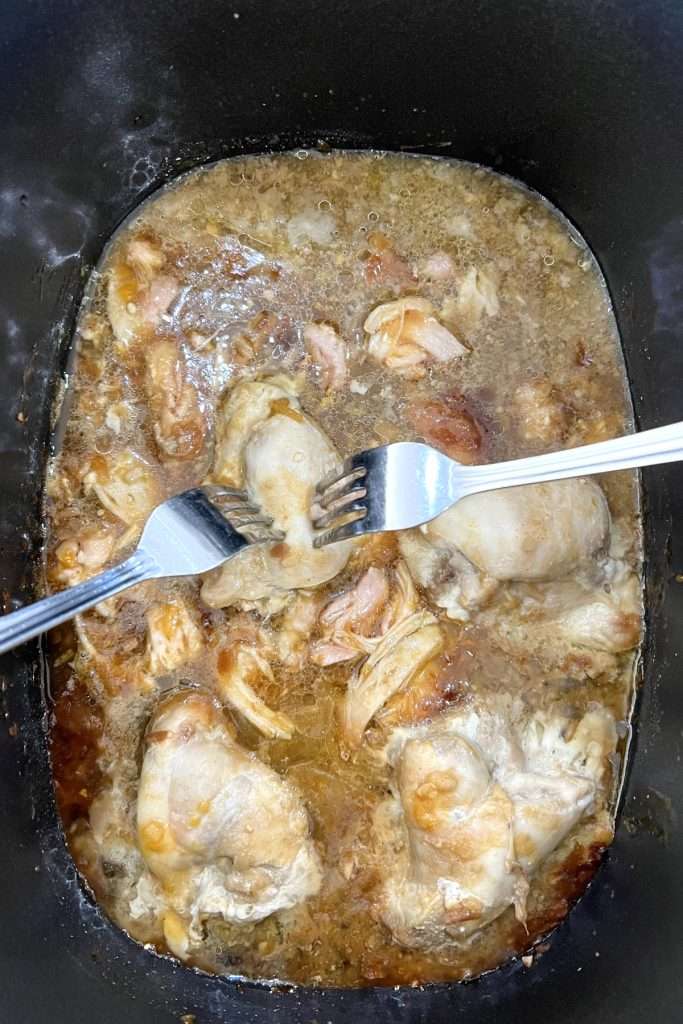 Use two forks to shred the chicken