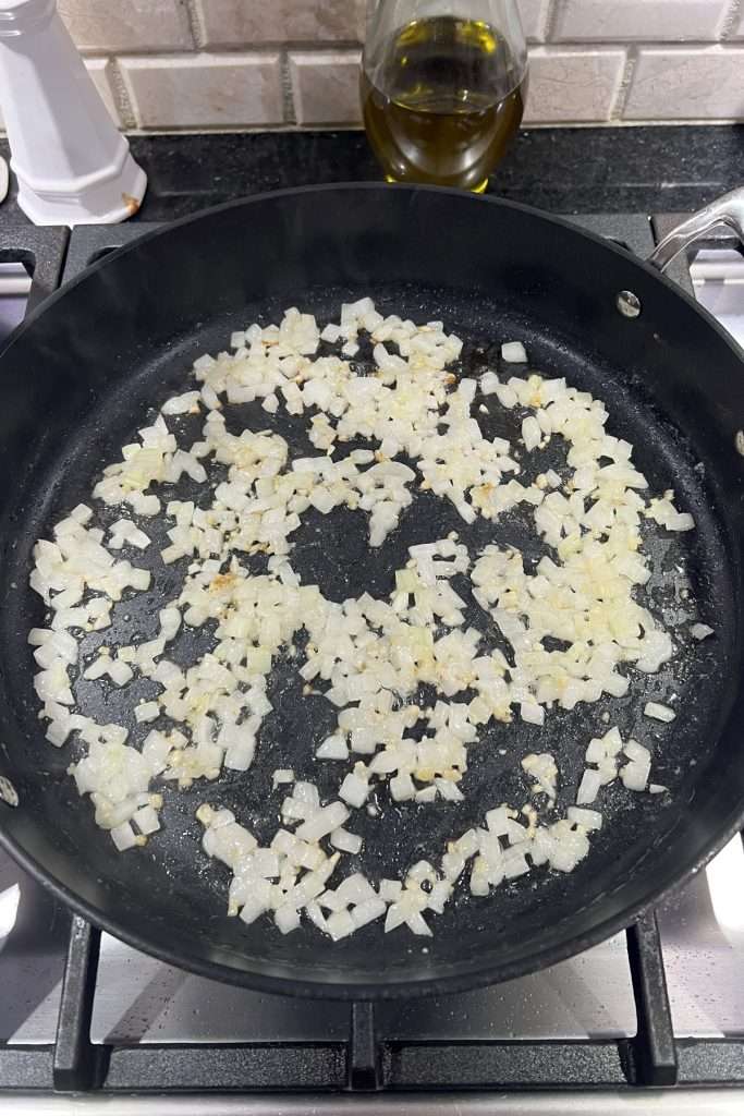 Saute onions and garlic in butter