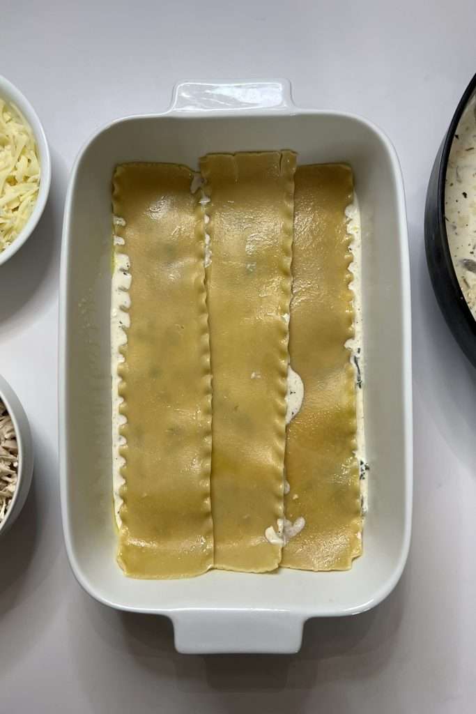 Add a layer of cooked noodles.