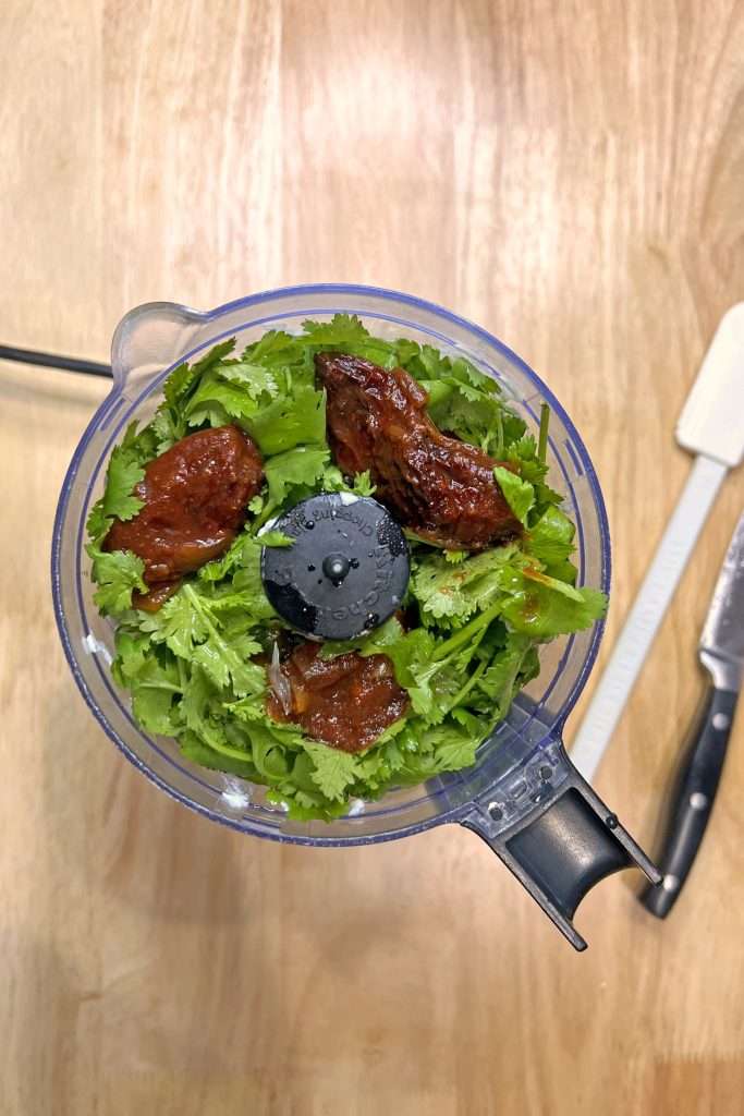 Place all ingredients in a blender or food processor.