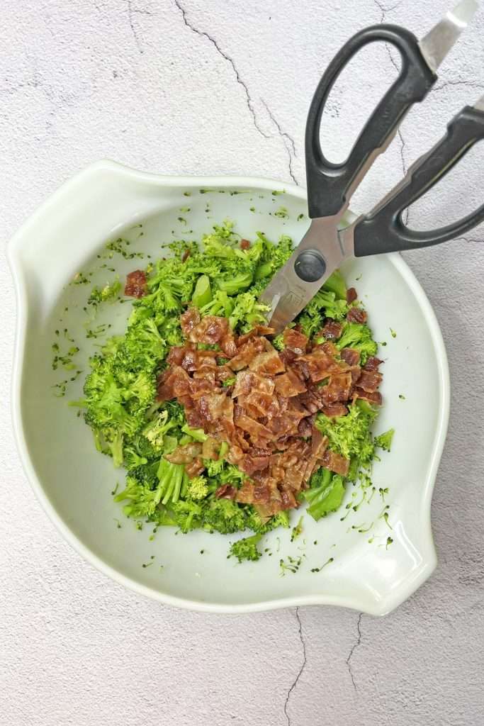 Cook and chop broccoli and bacon.