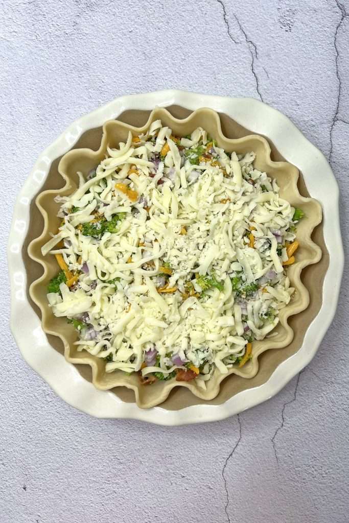 Add a layer of shredded mozzarella cheese.