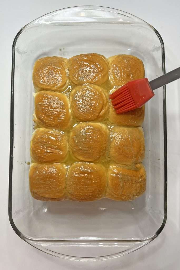 Brush the tops of the buns
