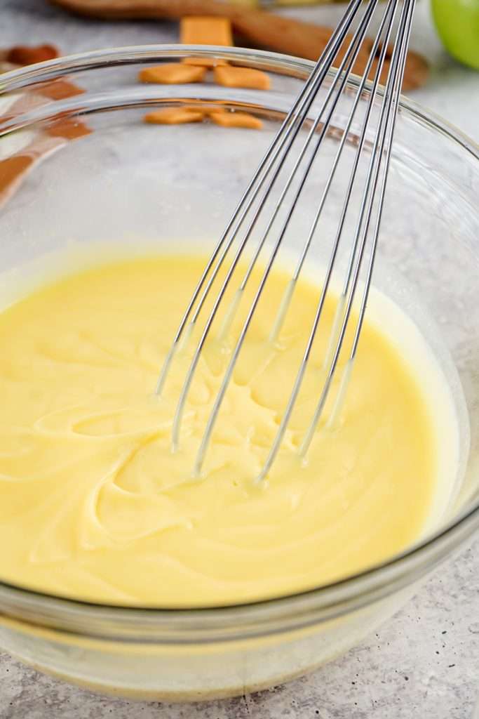 Whisk pudding until it thickens
