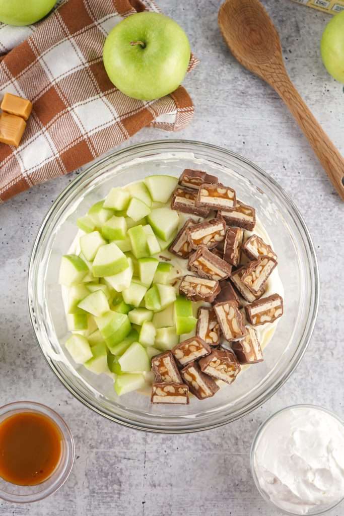 Add apple and Snicker bar pieces