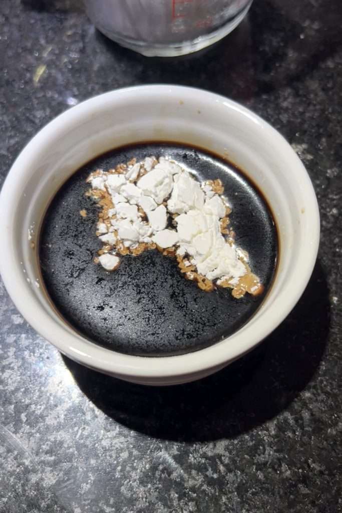Stir cornstarch into soy sauce.