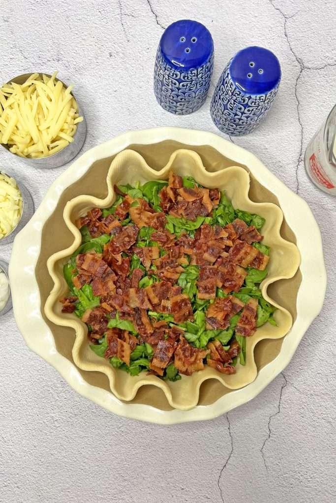 Add a layer of cooked, chopped bacon